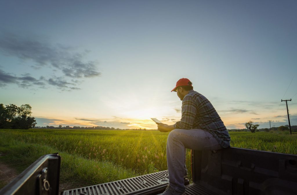 Farmer documenting CRP Costs on tablet